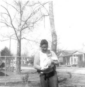 Ricky Marcus DeLeon Age 15 years, holding Frank DeLeon Jr. 